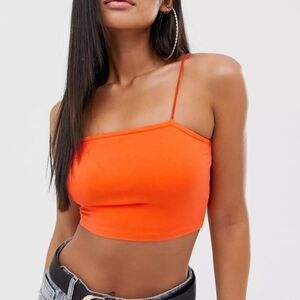 Orange crop top with a bandeau neckline and thin straps